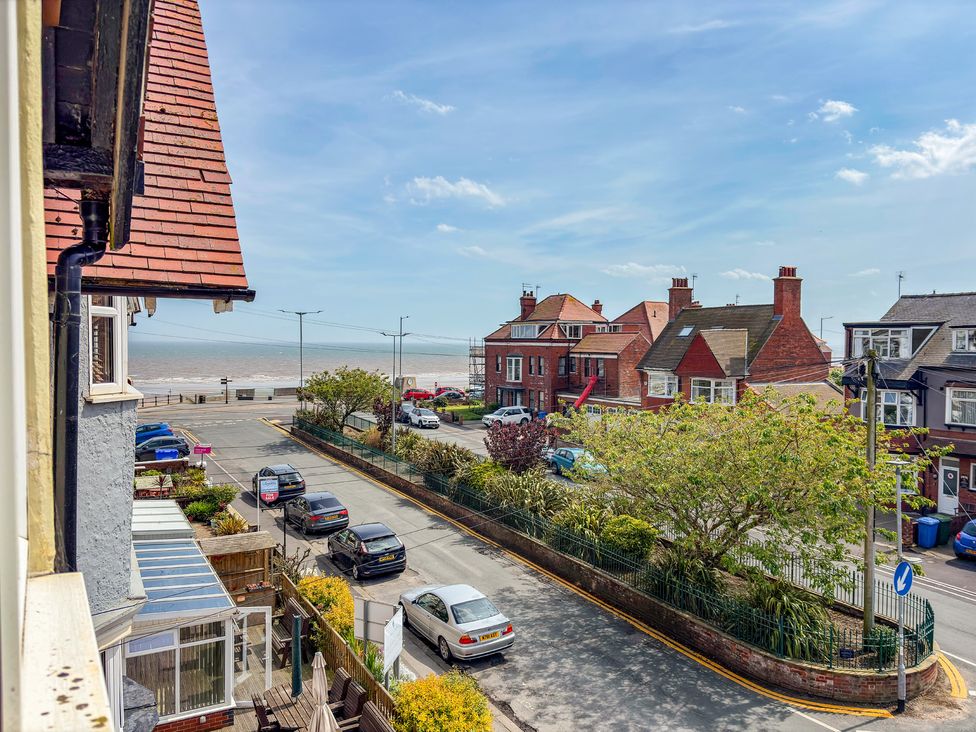A view of houses, cars, and the sea at Tapestry House in Bridlington