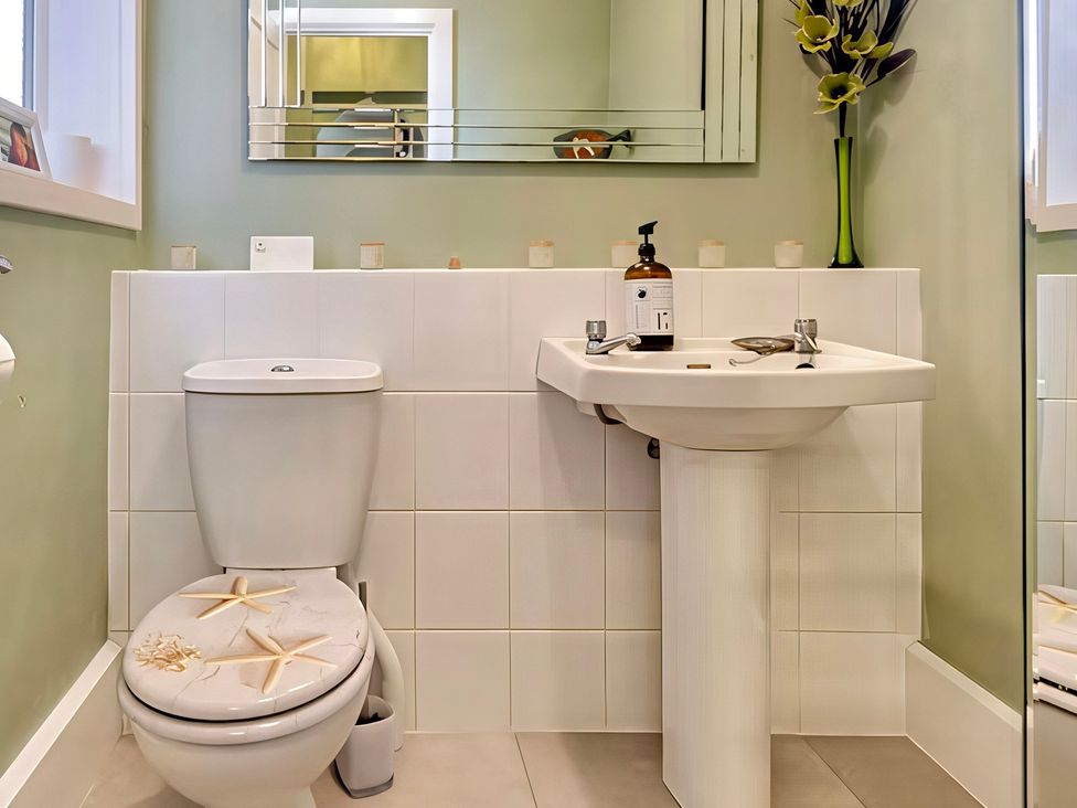 A bathroom with a toilet and sink at Tapestry House in Bridlington