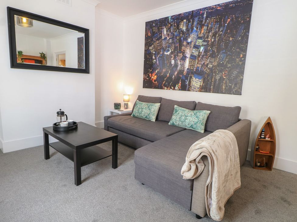 A living room with a sofa and coffee table at Foreshore in Deal
