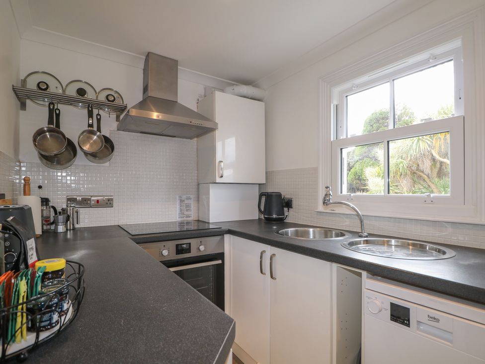 A kitchen with a sink and dishwasher at Foreshore in Deal