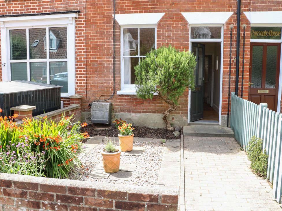 A front yard with plants and a pathway at 19 Covert Road Reydon