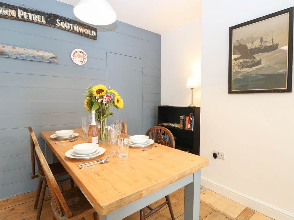 A dining room with a table set for a meal at 19 Covert Road in Reydon