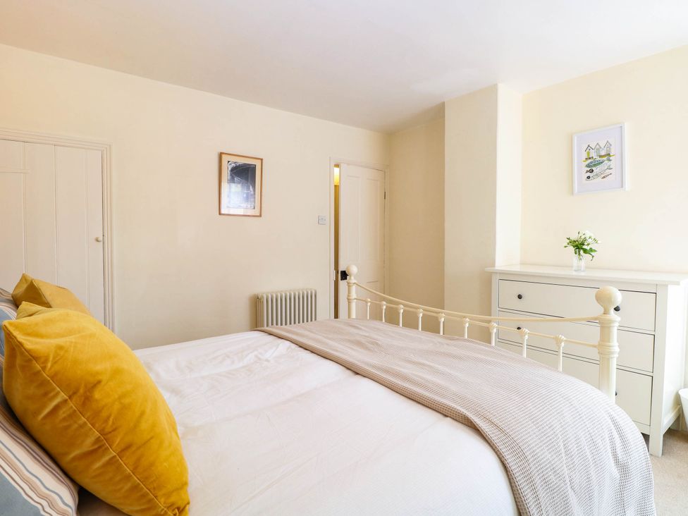 A bedroom with a bed and a dresser at 19 Covert Road in Reydon