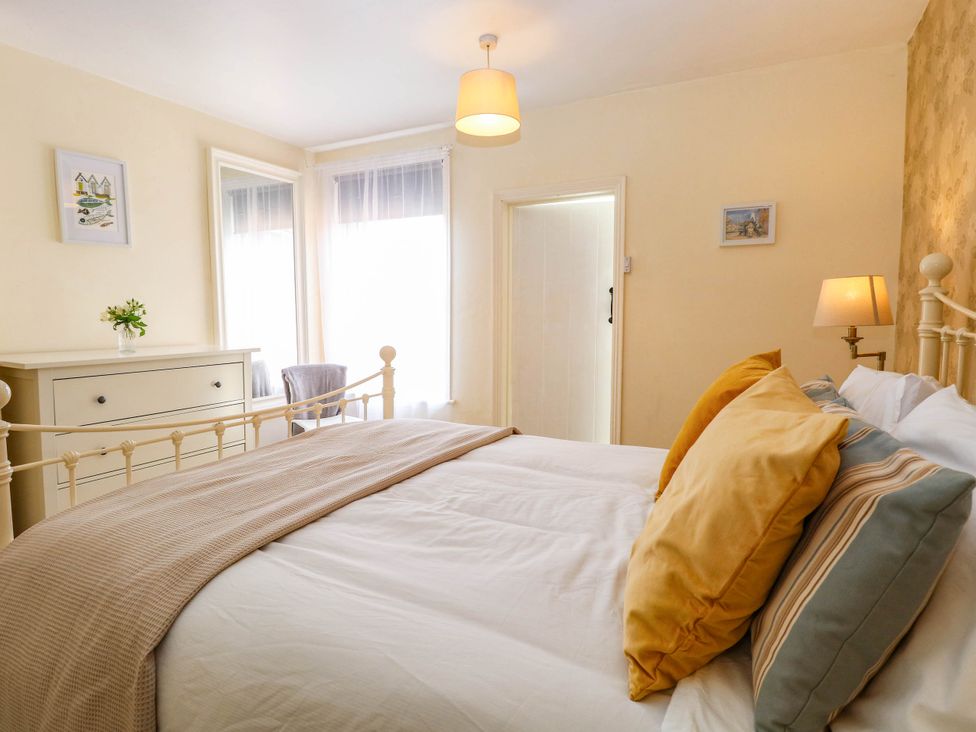 A bedroom with a bed and chest of drawers at 19 Covert Road in Reydon