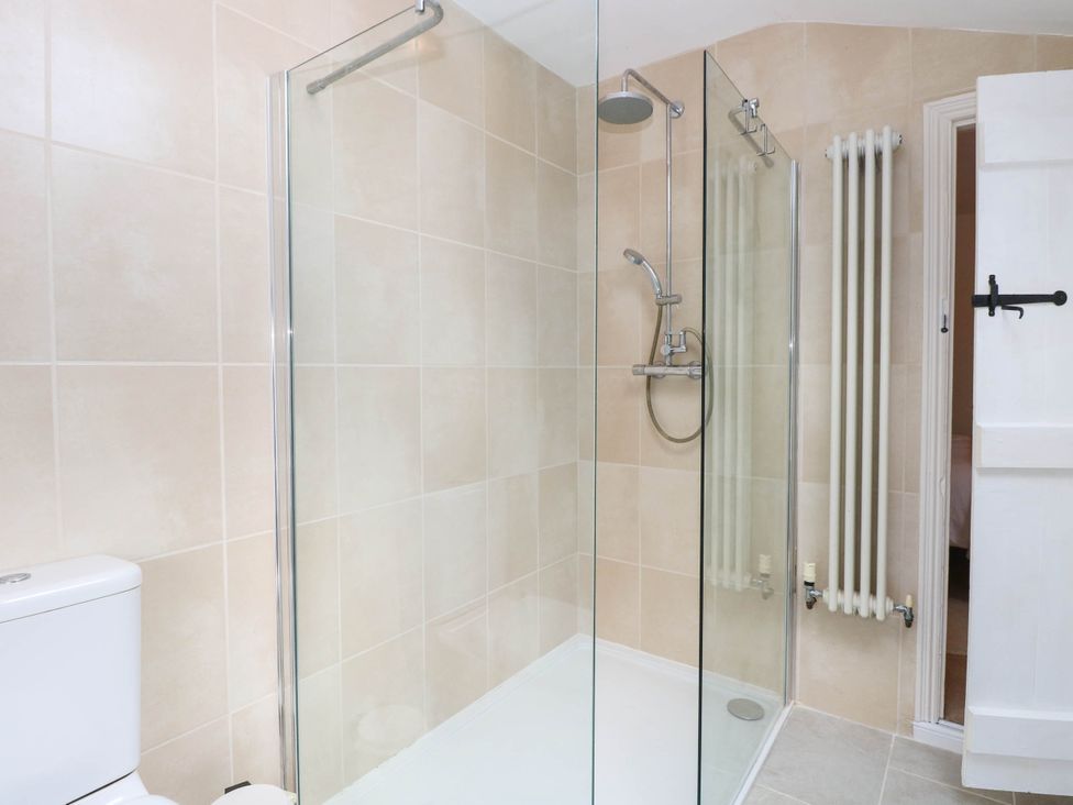 A bathroom with a shower and toilet at 19 Covert Road in Reydon