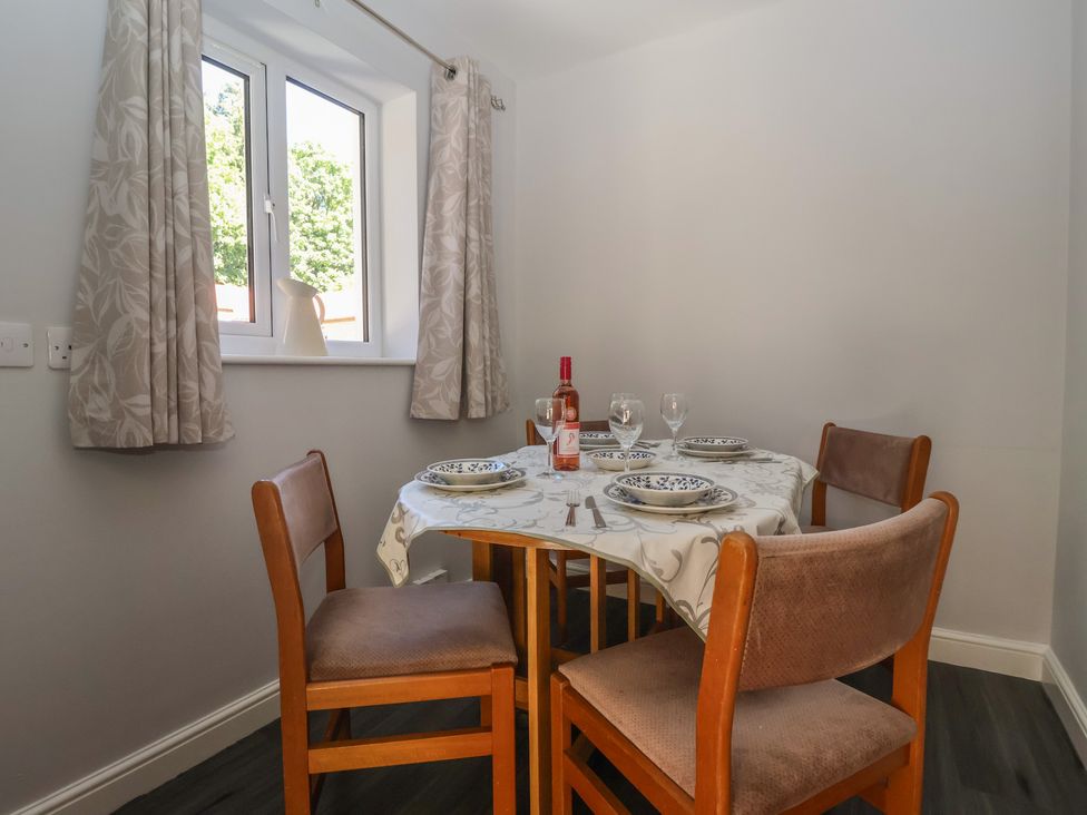 A dining room with a table and chairs at Sea View in Scarborough