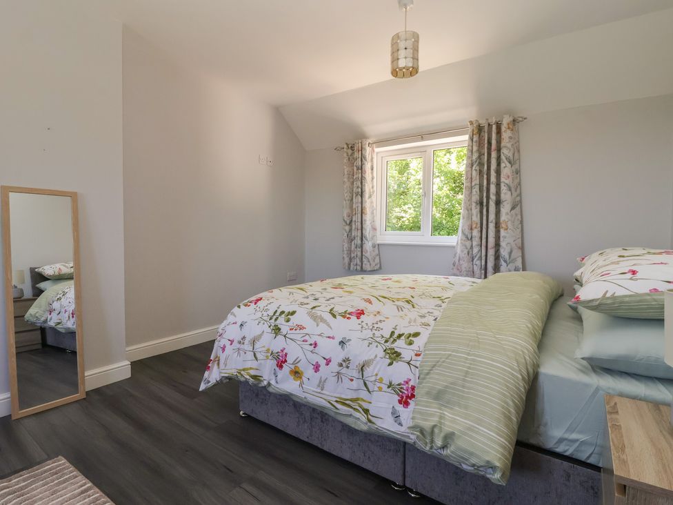 A bedroom with a bed and a window at Sea View in Scarborough
