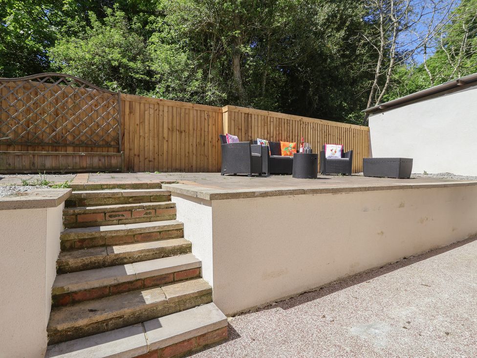 A garden with seating area and steps at Sea View in Scarborough