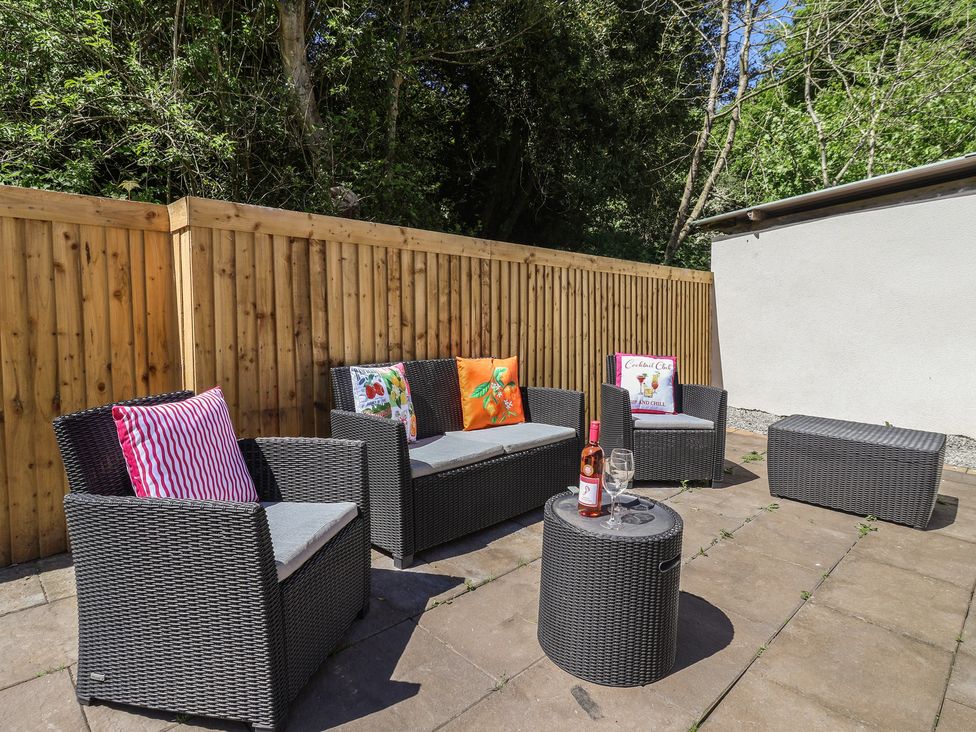 A garden with outdoor seating and a coffee table at Sea View in Scarborough