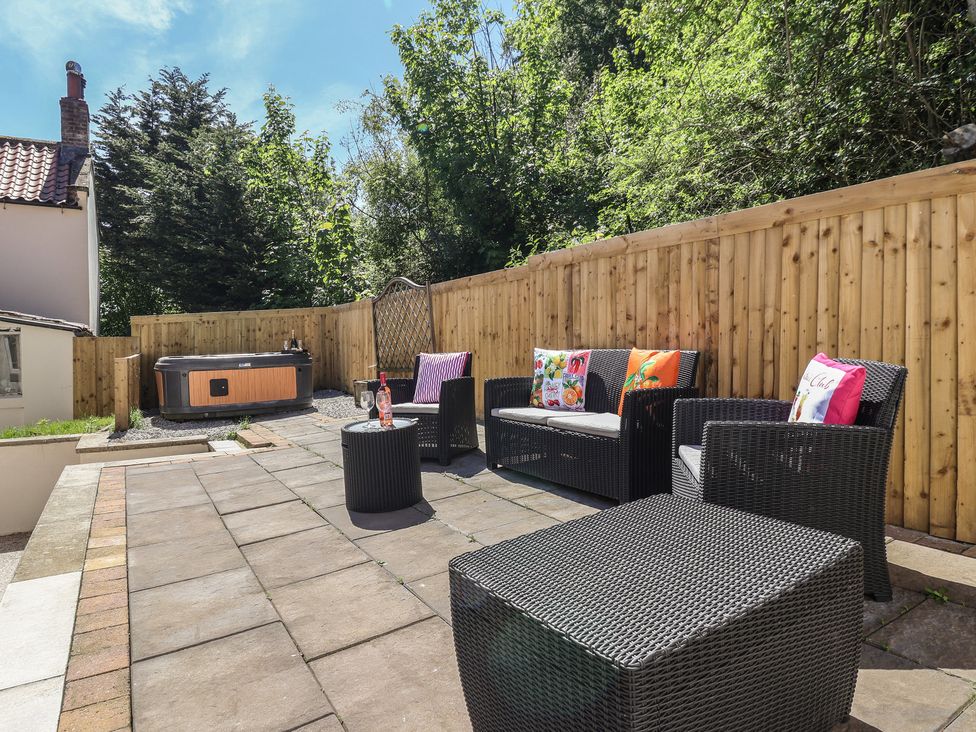A garden with outdoor seating and a hot tub at Sea View in Scarborough