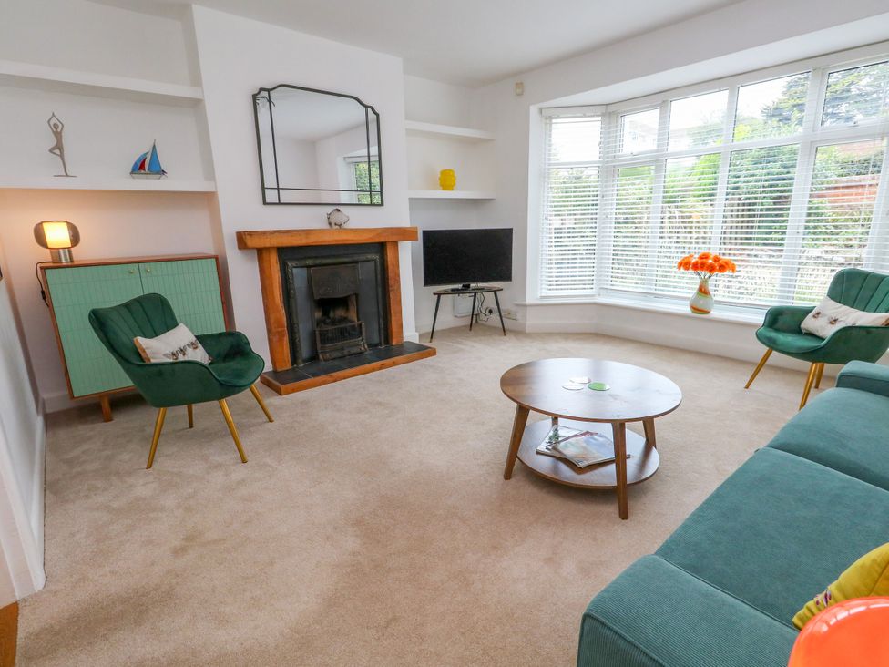 A living room with a sofa and coffee table at 29 Bincleaves Road in Weymouth