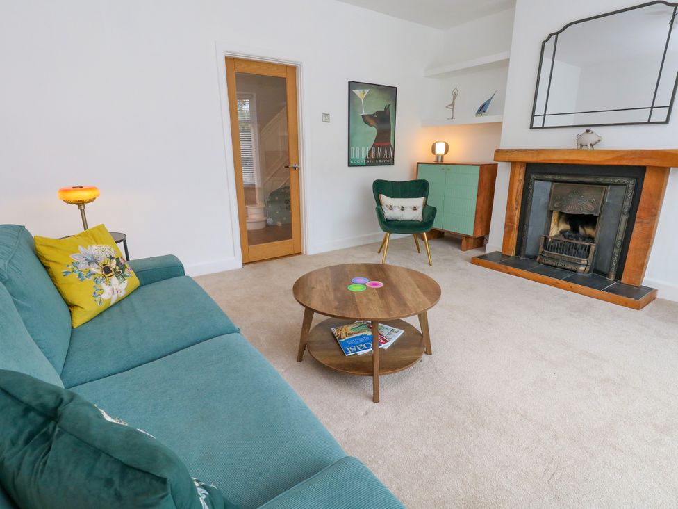 A living room with a sofa and table at 29 Bincleaves Road in Weymouth