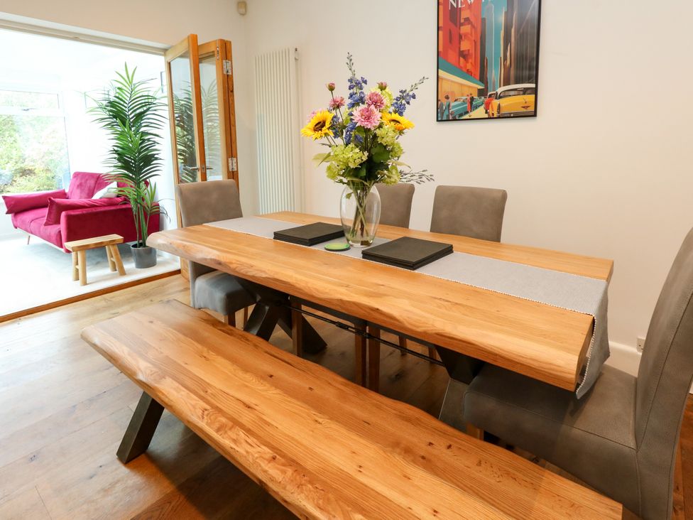 A dining room with a table and chairs at 29 Bincleaves Road Weymouth