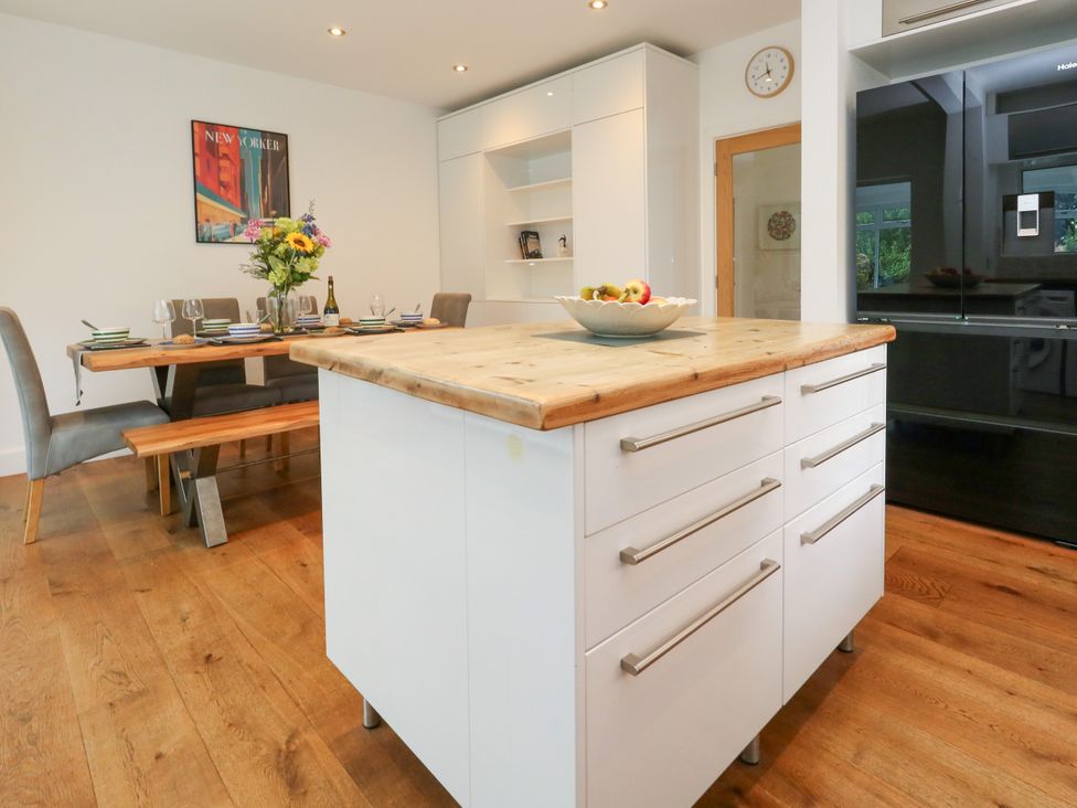 A kitchen with a dining table and chairs at 29 Bincleaves Road Weymouth
