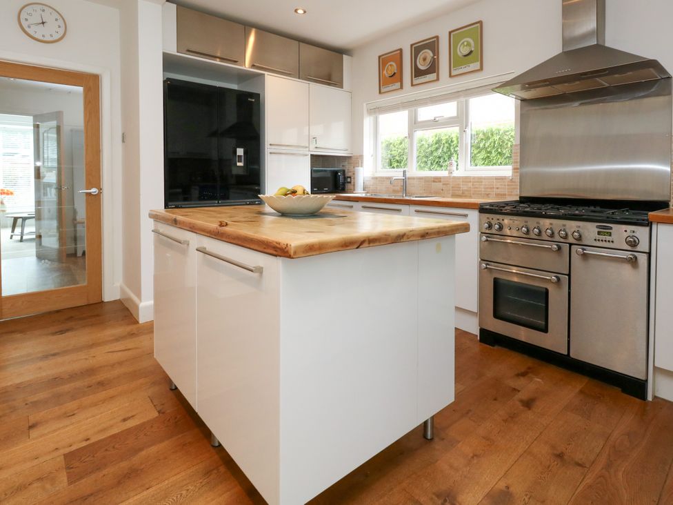 A kitchen with an island and appliances at 29 Bincleaves Road, Weymouth