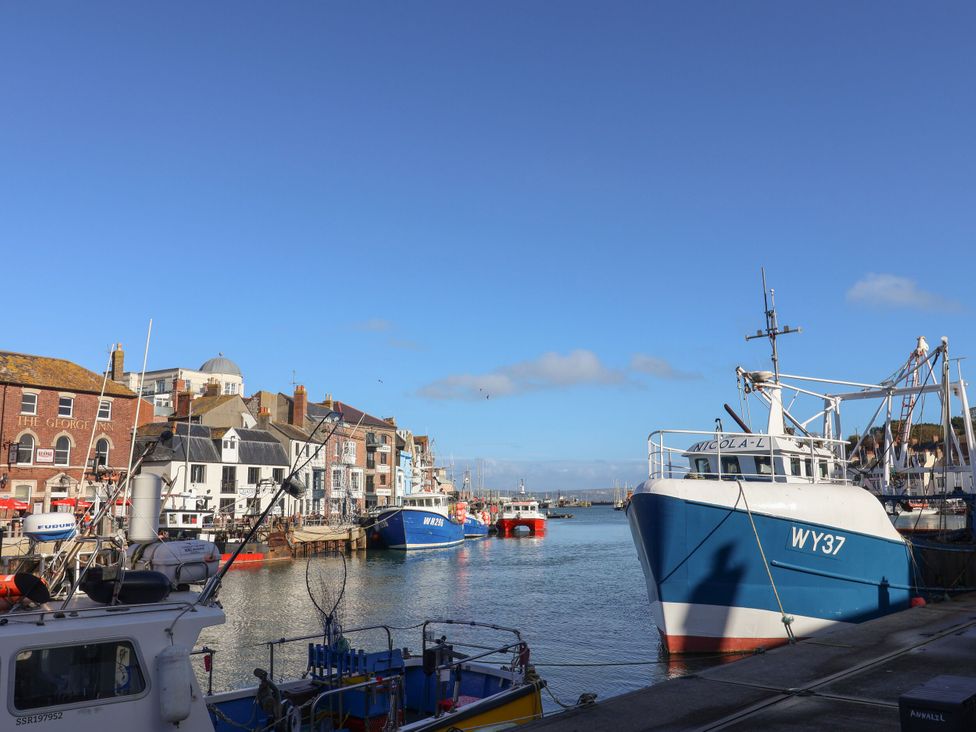 A harbor with boats and buildings at 29 Bincleaves Road Weymouth