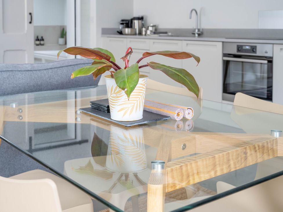 A dining room with a table and plant at Blackwood in Hornsea