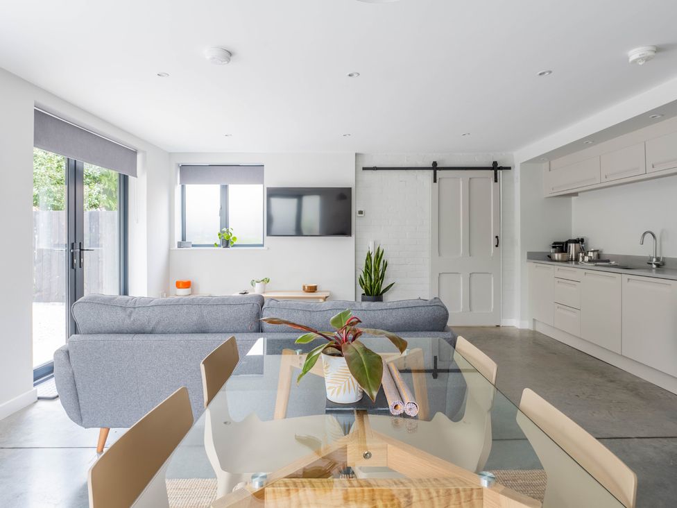 A living room with a sofa and television at Blackwood in Hornsea