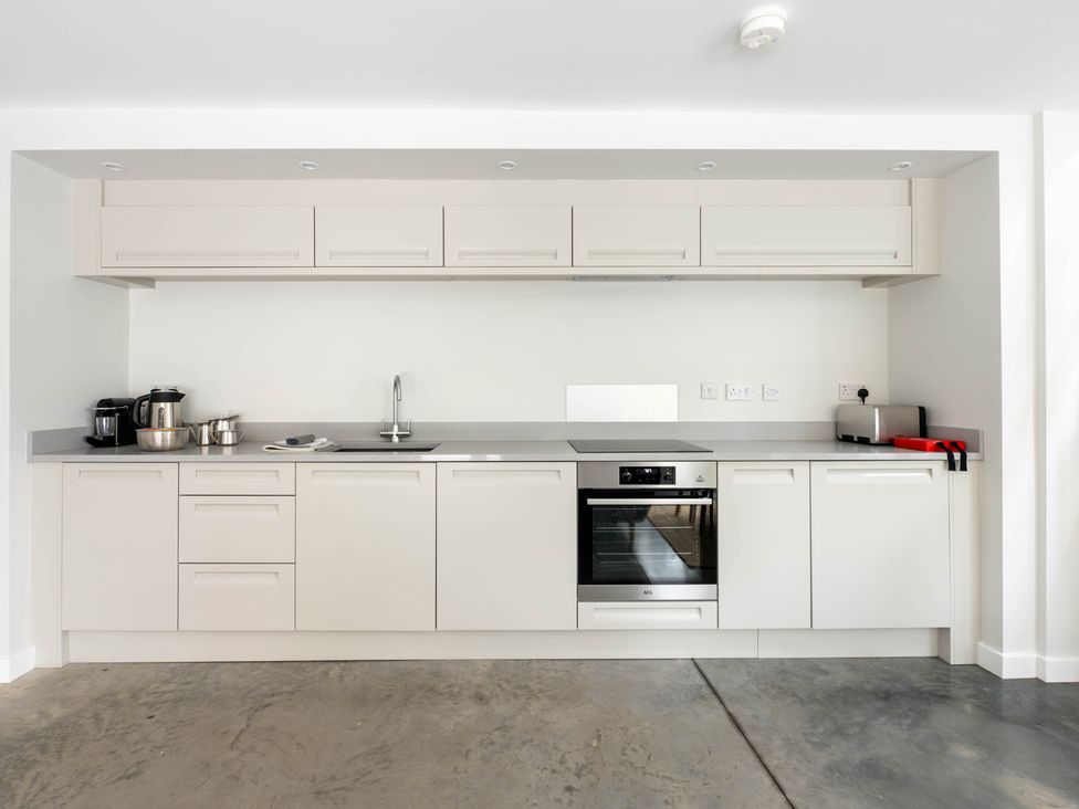 A kitchen with cabinets and appliances at Blackwood in Hornsea