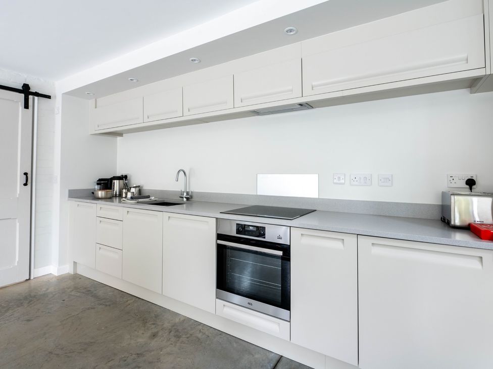 A kitchen with cabinets and appliances at Blackwood Hornsea
