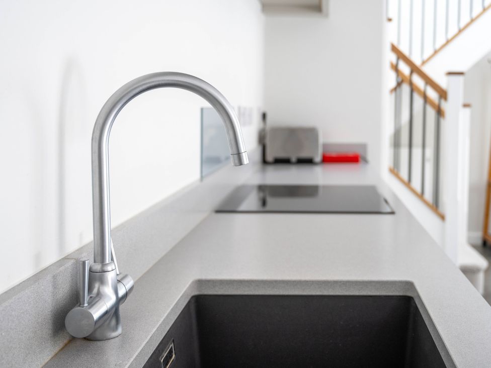 A kitchen with a sink and faucet at Blackwood in Hornsea