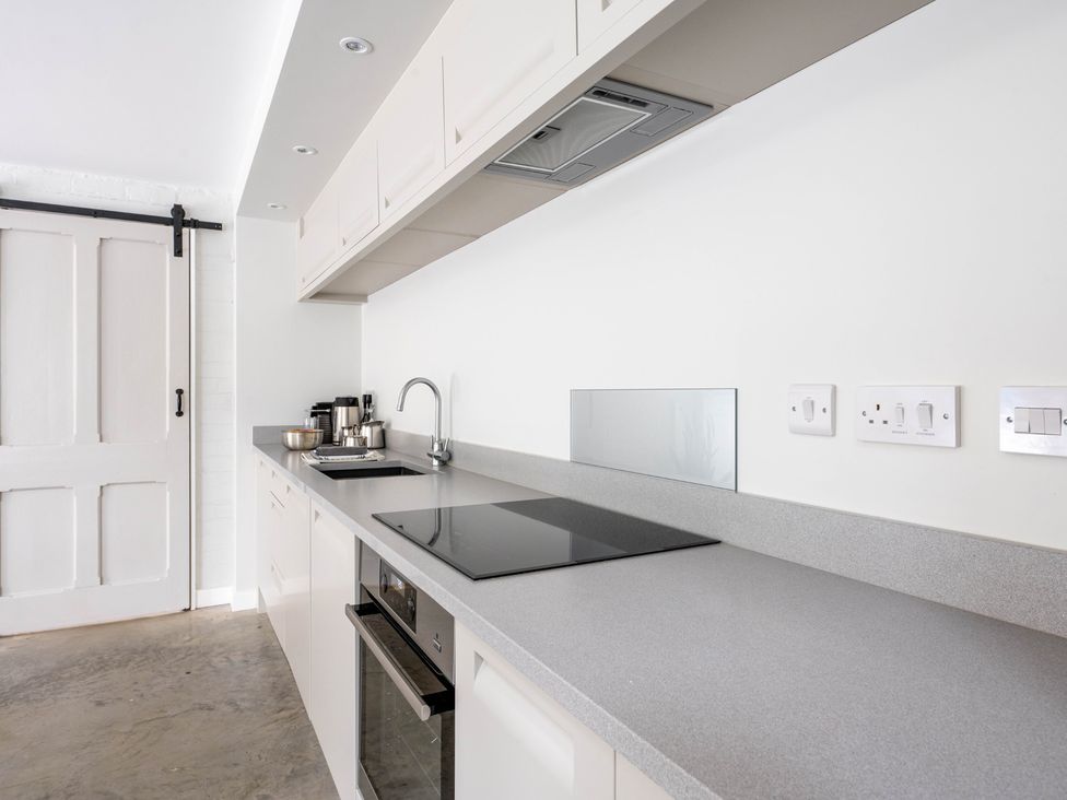 A kitchen with cabinets and appliances at Blackwood in Hornsea