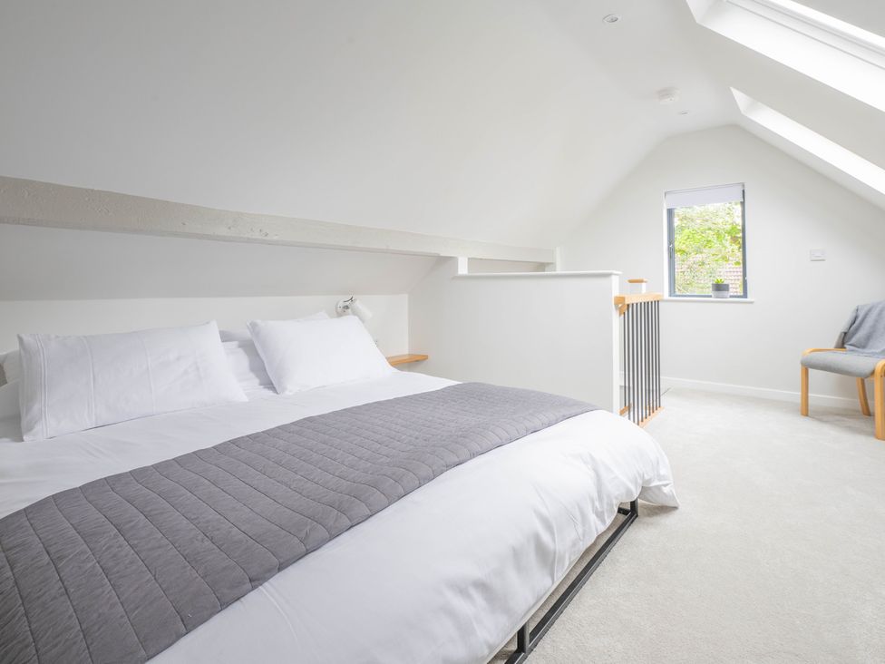 A bedroom with a bed and a window at Blackwood in Hornsea