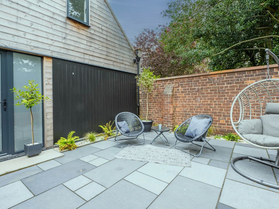 An outdoor area with chairs and a table at Blackwood in Hornsea