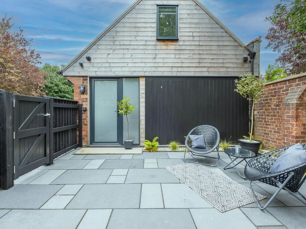 An outdoor area with chairs and a table at Blackwood in Hornsea