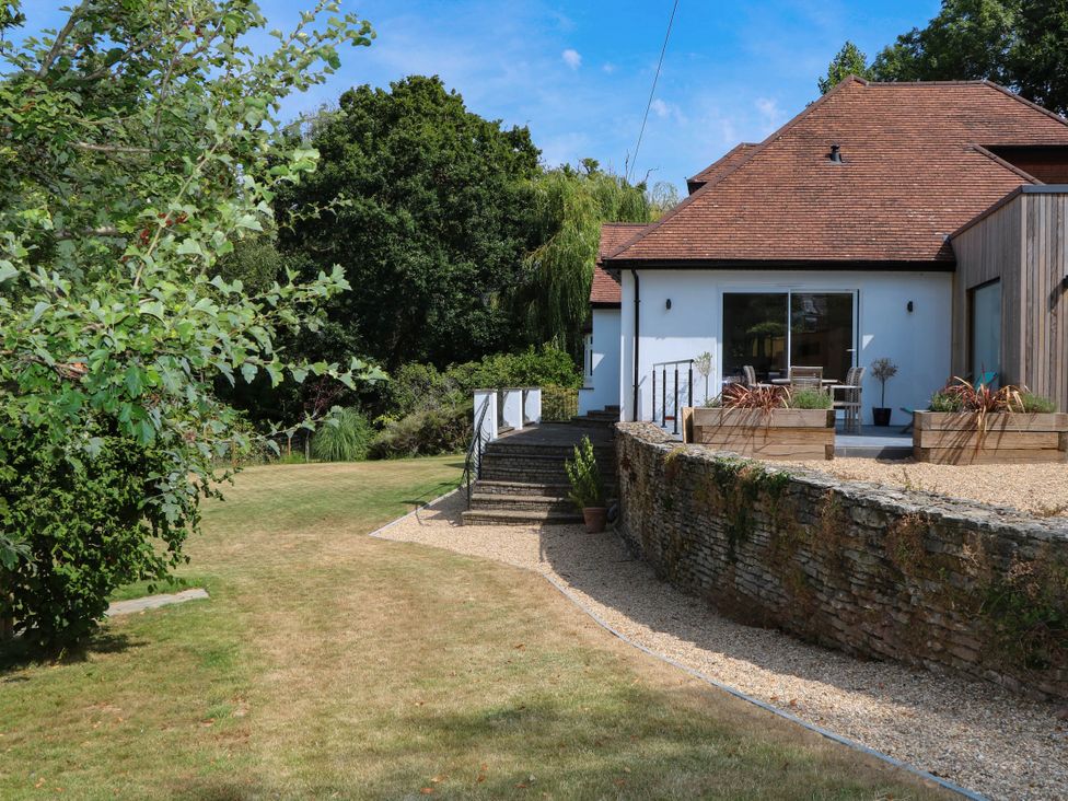 A garden with stairs and a house at Cree Cottage 
