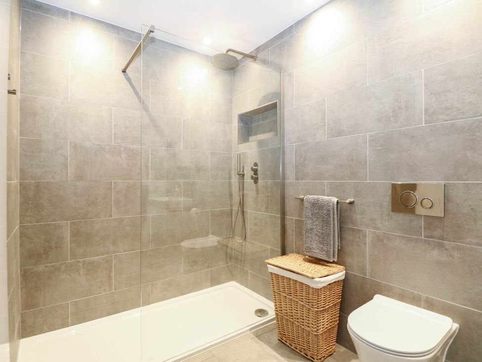 A bathroom with a shower and toilet at Cree Cottage