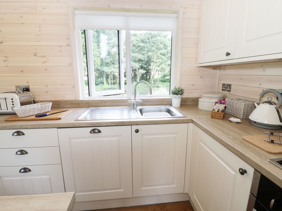 A kitchen with a sink and window at Kingfisher in Ross-on-Wye