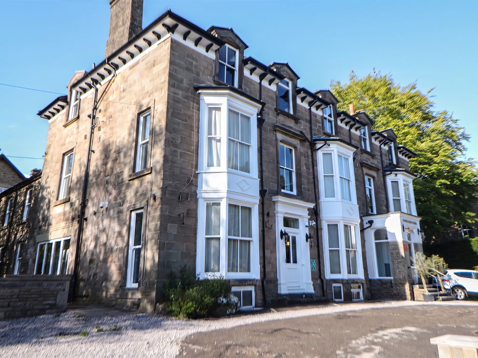 A house with multiple windows and doors at The Pavillon Suite in Buxton