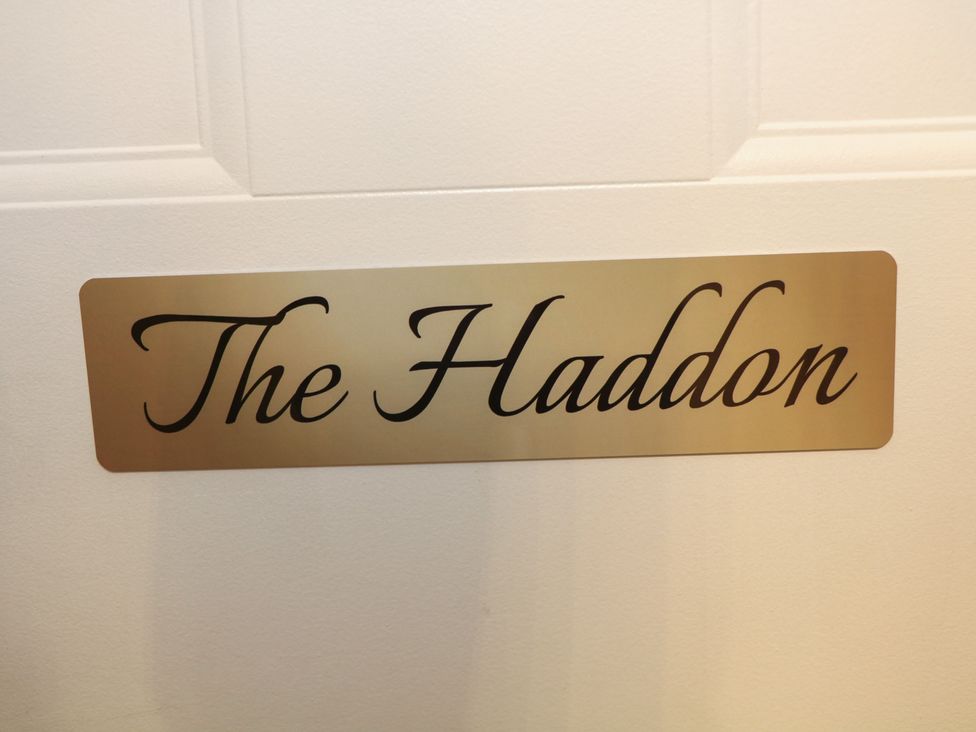A sign that reads The Haddon at The Haddon Suite in Buxton