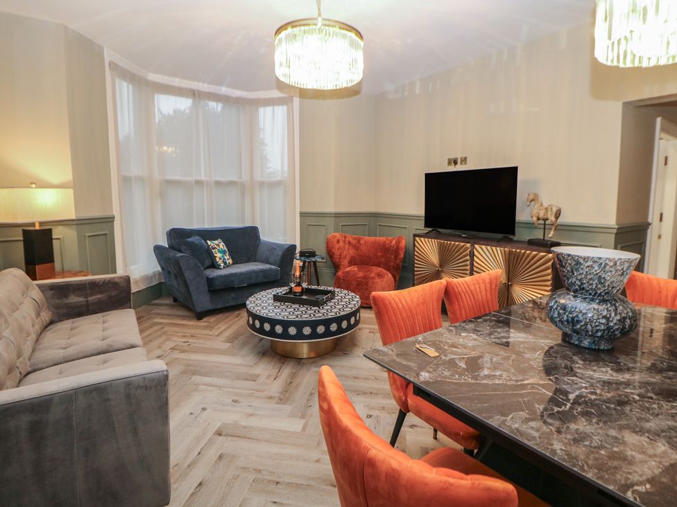 A living room with a sofa and a coffee table at The Haddon Suite in Buxton