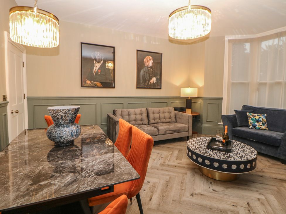 A living room with a sofa and coffee table at The Haddon Suite in Buxton