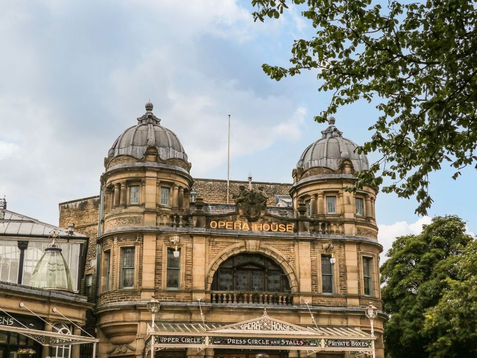 A theater building with domes and signage at The Haddon Suite in Buxton