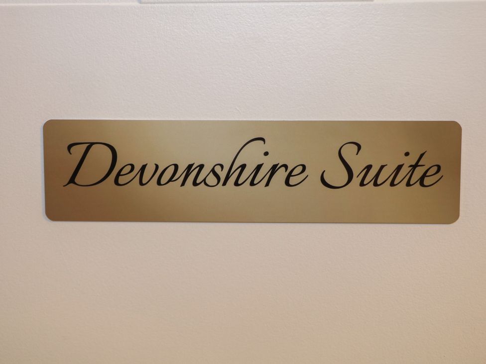 A sign labeled Devonshire Suite at The Devonshire Suite Buxton