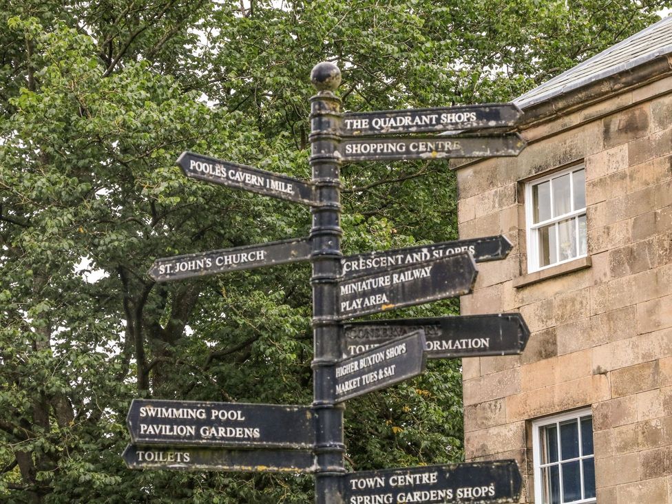 A directional signpost with various points of interest at The Devonshire Suite Buxton