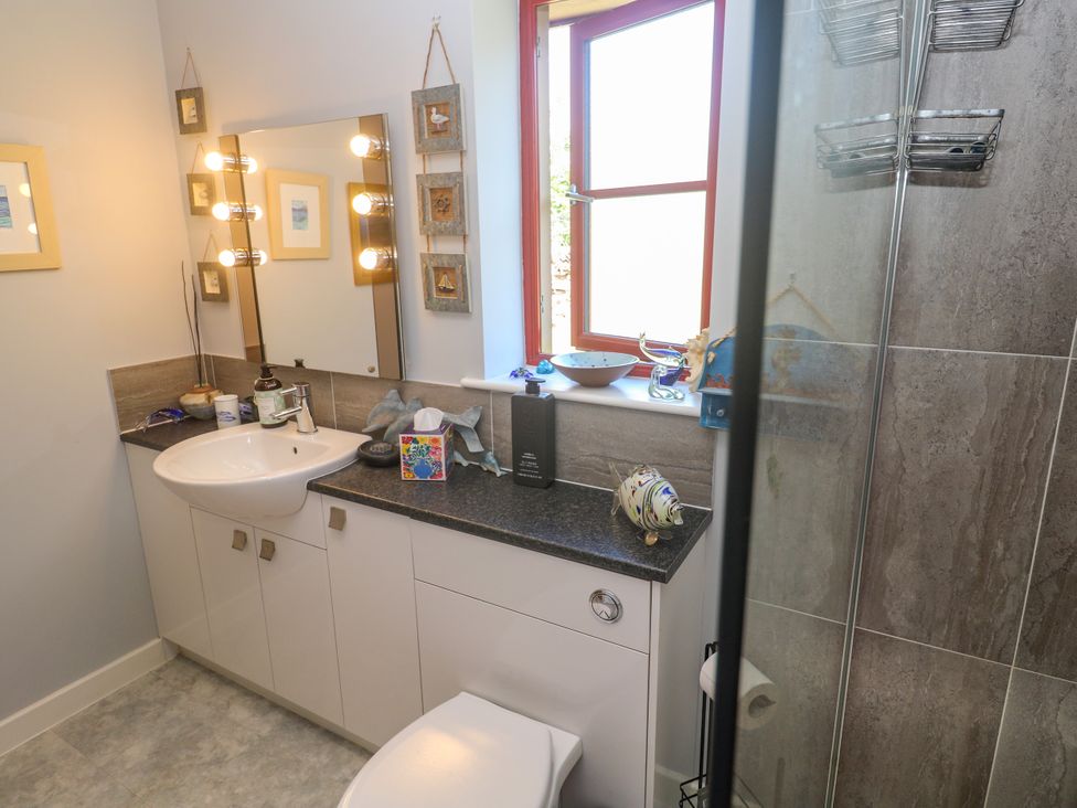 A bathroom with a sink and shower at Yonde View in Camborne