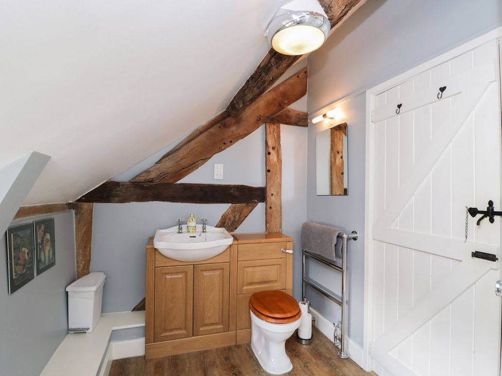 A bathroom with a sink and toilet at The Old Barn in Hereford