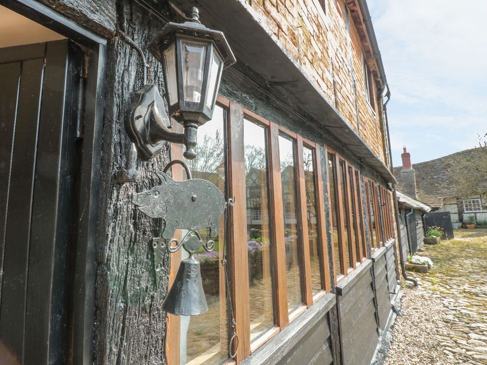 An outdoor view of a building with a lantern and pig bell at The Granary in Hereford