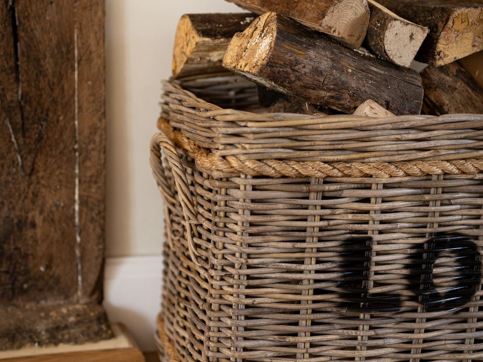 A basket filled with firewood at Ambersham House in Midhurst
