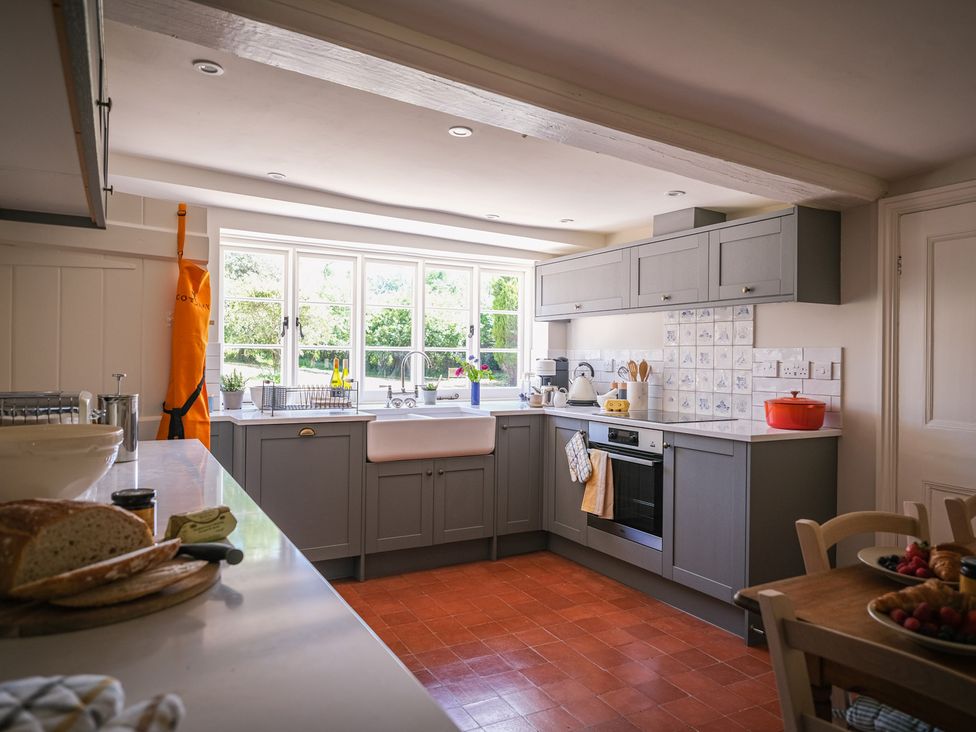 A kitchen with appliances and utensils at Challens Yarde in Midhurst