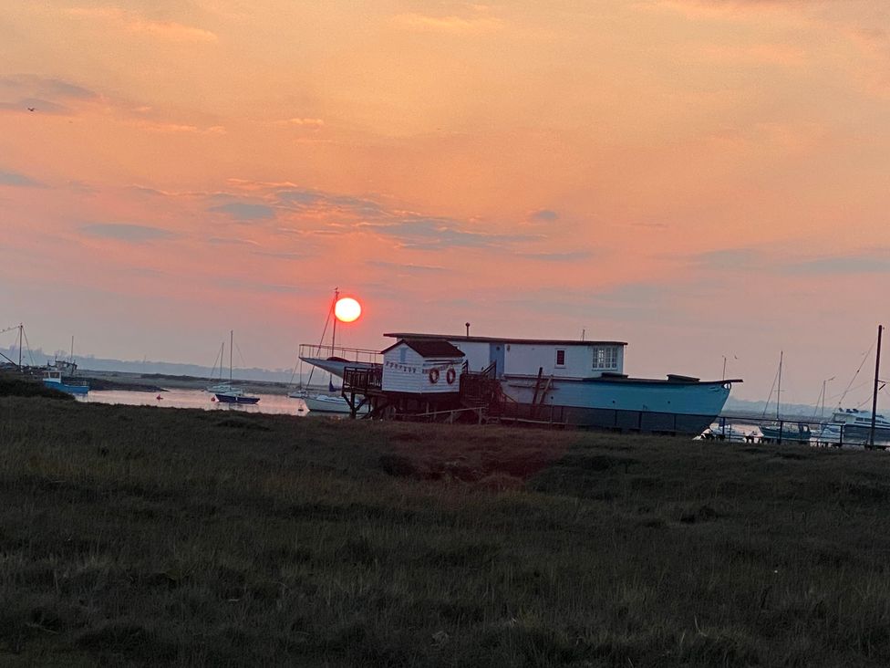 A boat at a dock during sunset at Oakwood Annexe Colchester