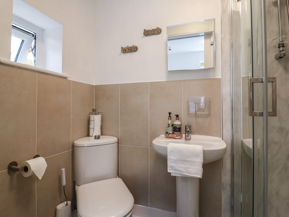 A bathroom with a toilet and sink at Oakwood Annexe Colchester