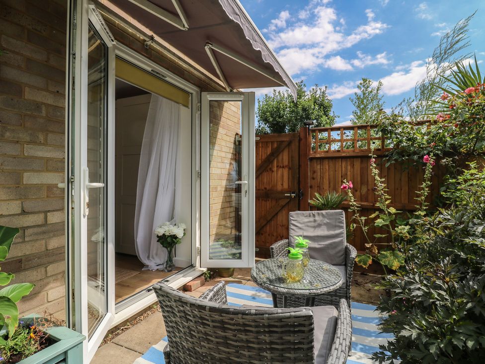 A garden with seating and plants at Oakwood Annexe in Colchester