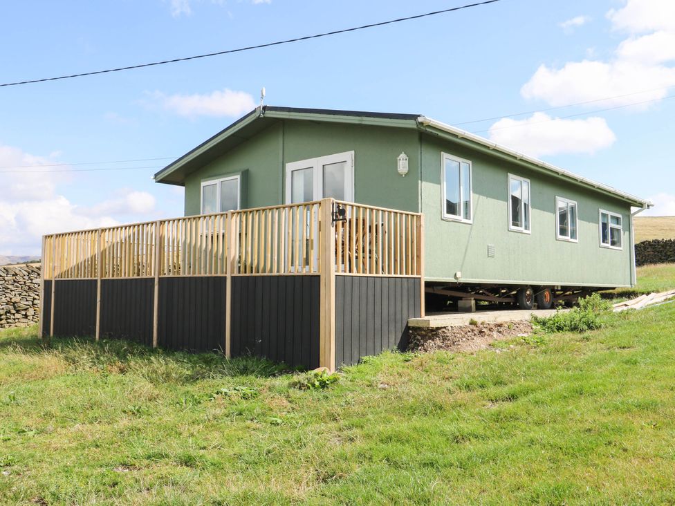A house with a fenced area at Lodge in High Peak