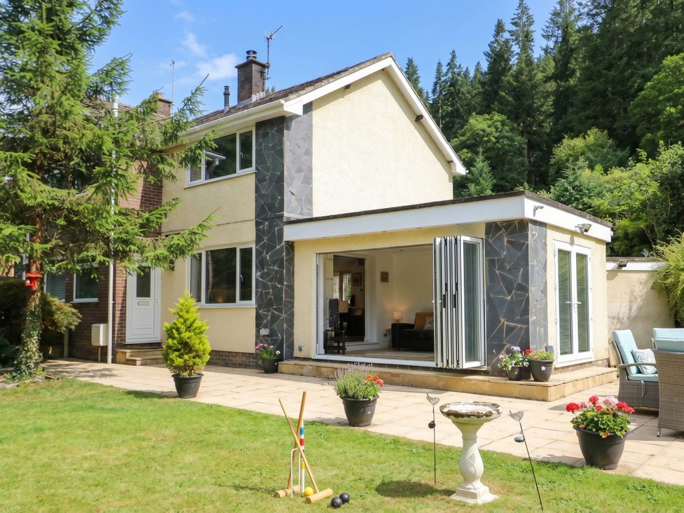 A house with a garden and patio area at Dyffryn in Betws-Y-Coed