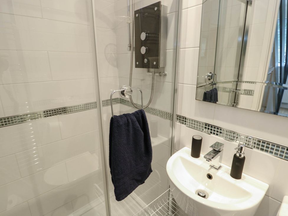 A bathroom with shower and sink at Dyffryn in Betws-Y-Coed